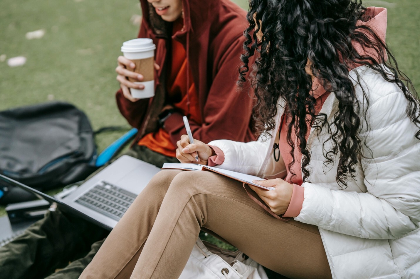 Two people having a meaningful conversation in a park setting